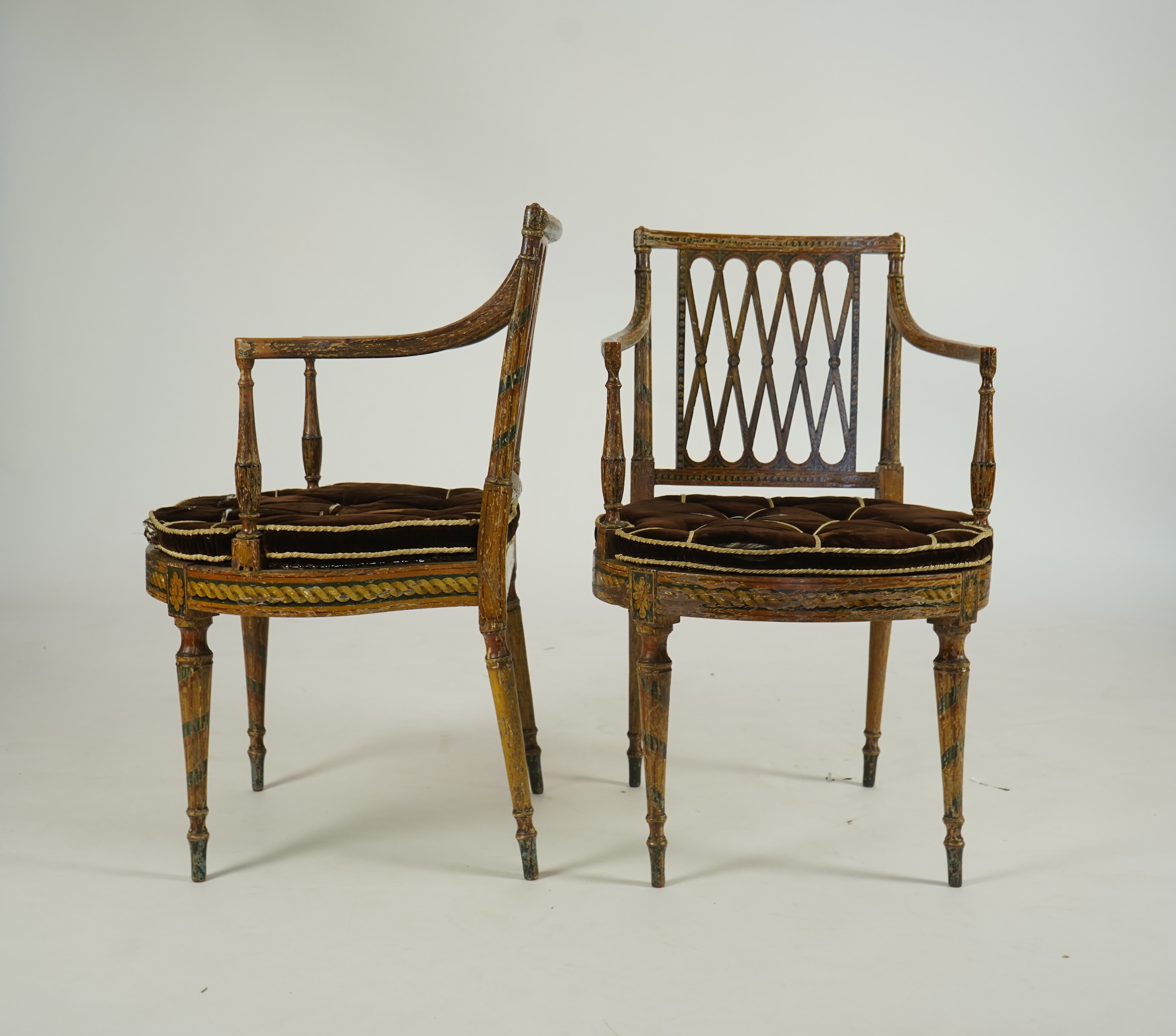 A set of six Sheraton period painted decorated cane seat elbow chairs